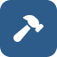 Icon of a hammer on a blue background, representing craft or construction work.